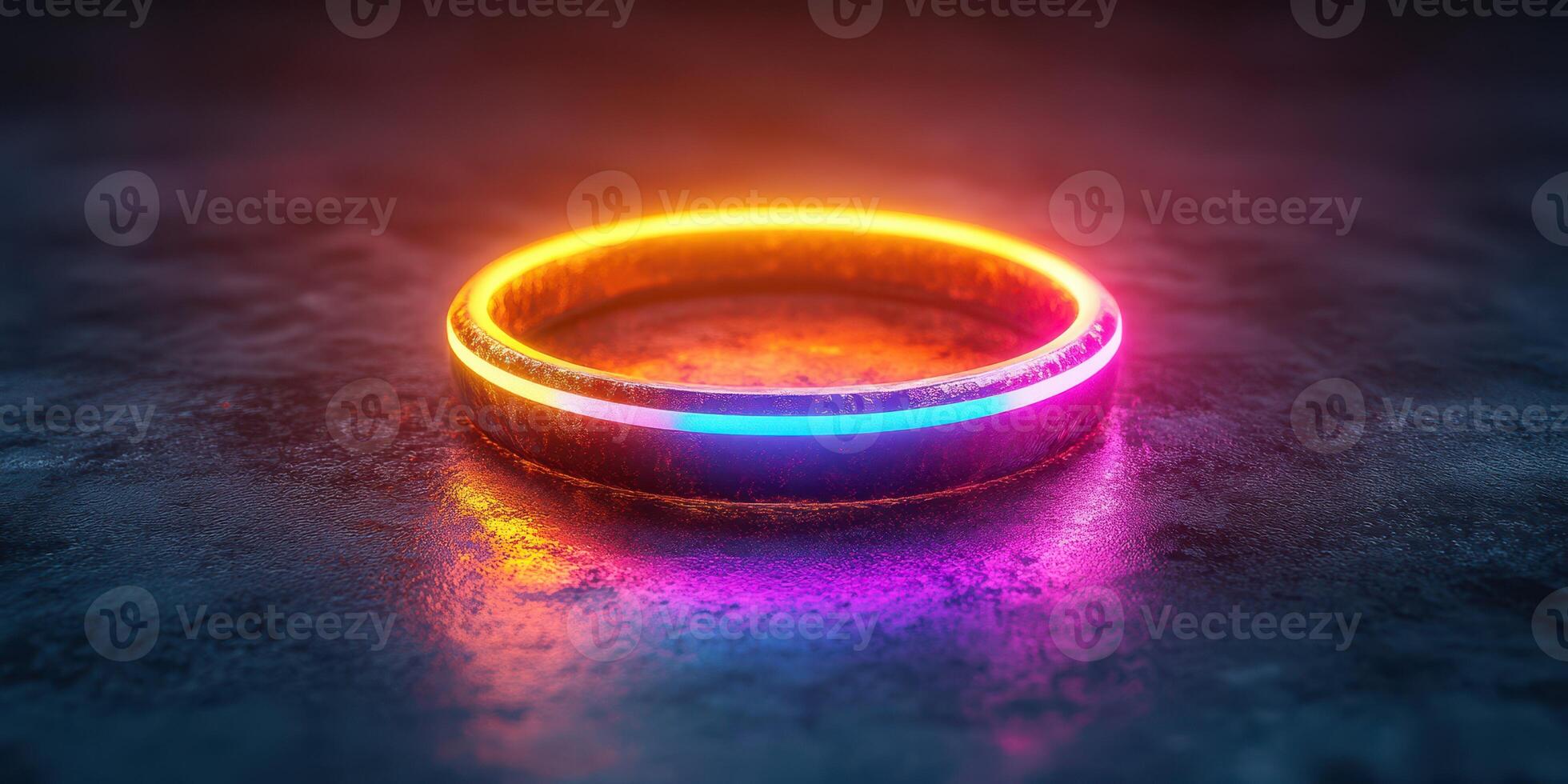 Colorful neon ring illuminated on a textured surface in a dark setting with reflections and glowing effects photo