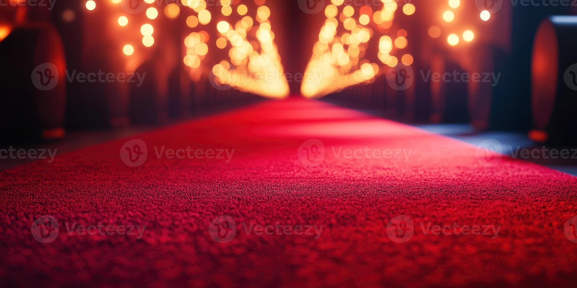 Brightly lit red carpet leading to an event venue with soft glowing lights and a glamorous atmosphere photo