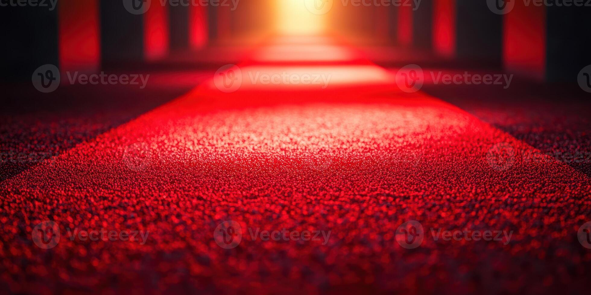 Vibrant red carpet leading to a glowing light in a dramatic indoor setting at dusk photo