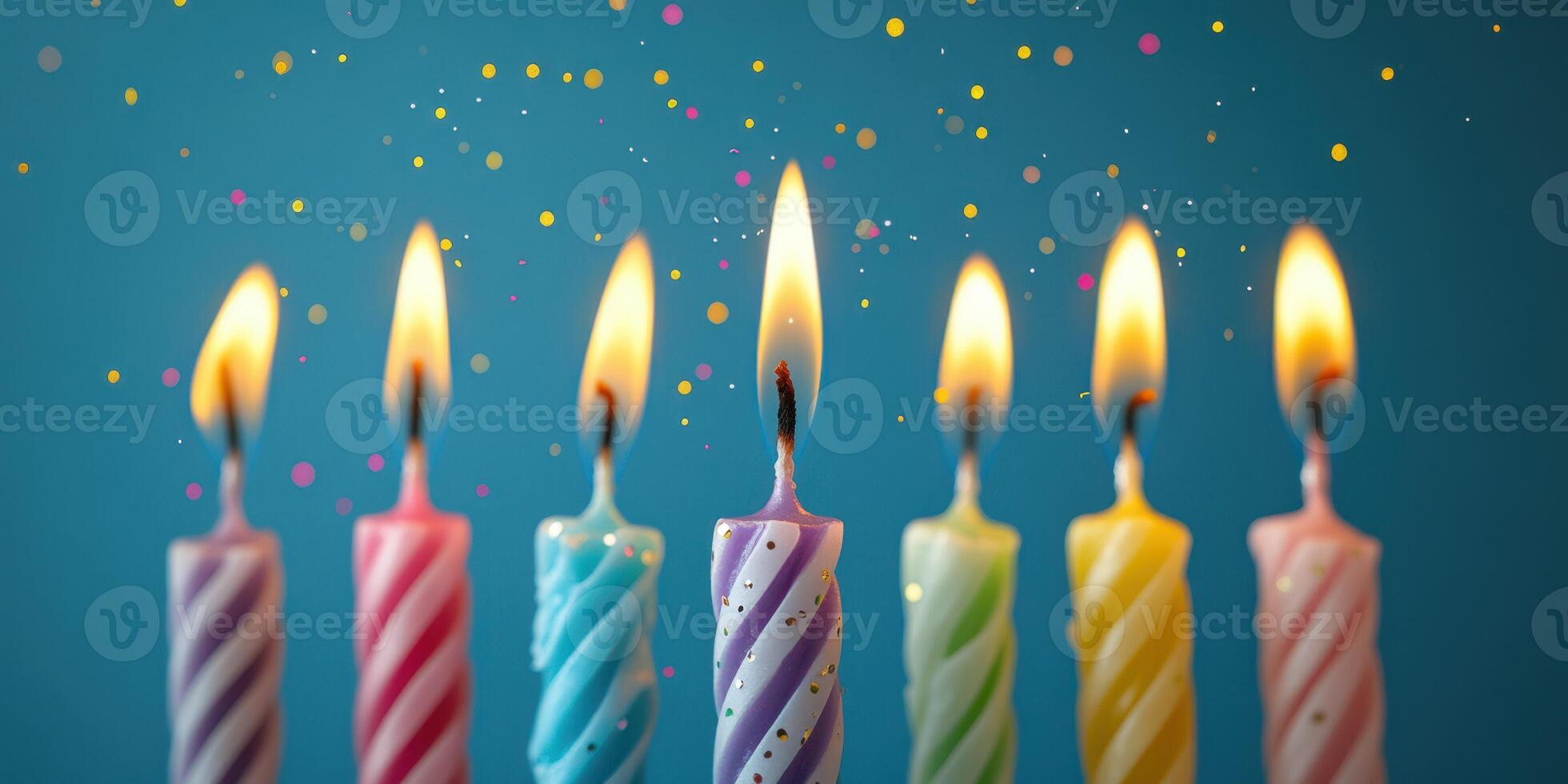 Colorful birthday candles with vibrant flames celebrating a joyful occasion surrounded by colorful confetti photo