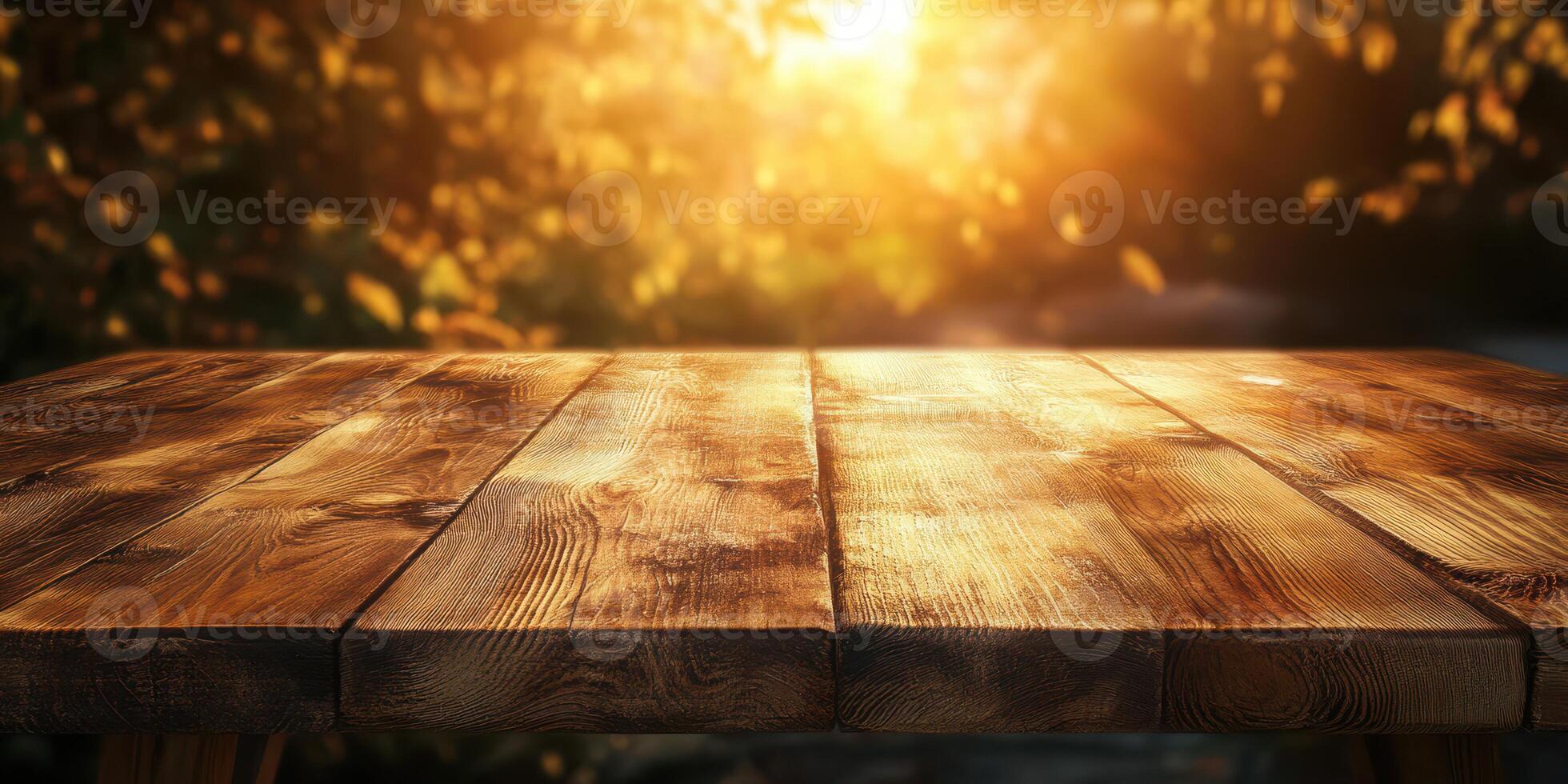 Sunlight gleams on a rustic wooden table surrounded by autumn foliage in a serene outdoor setting during golden hour photo
