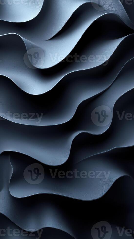 Textured dark blue fabric creates a wave-like pattern, showcasing depth and movement in an artistic design element photo