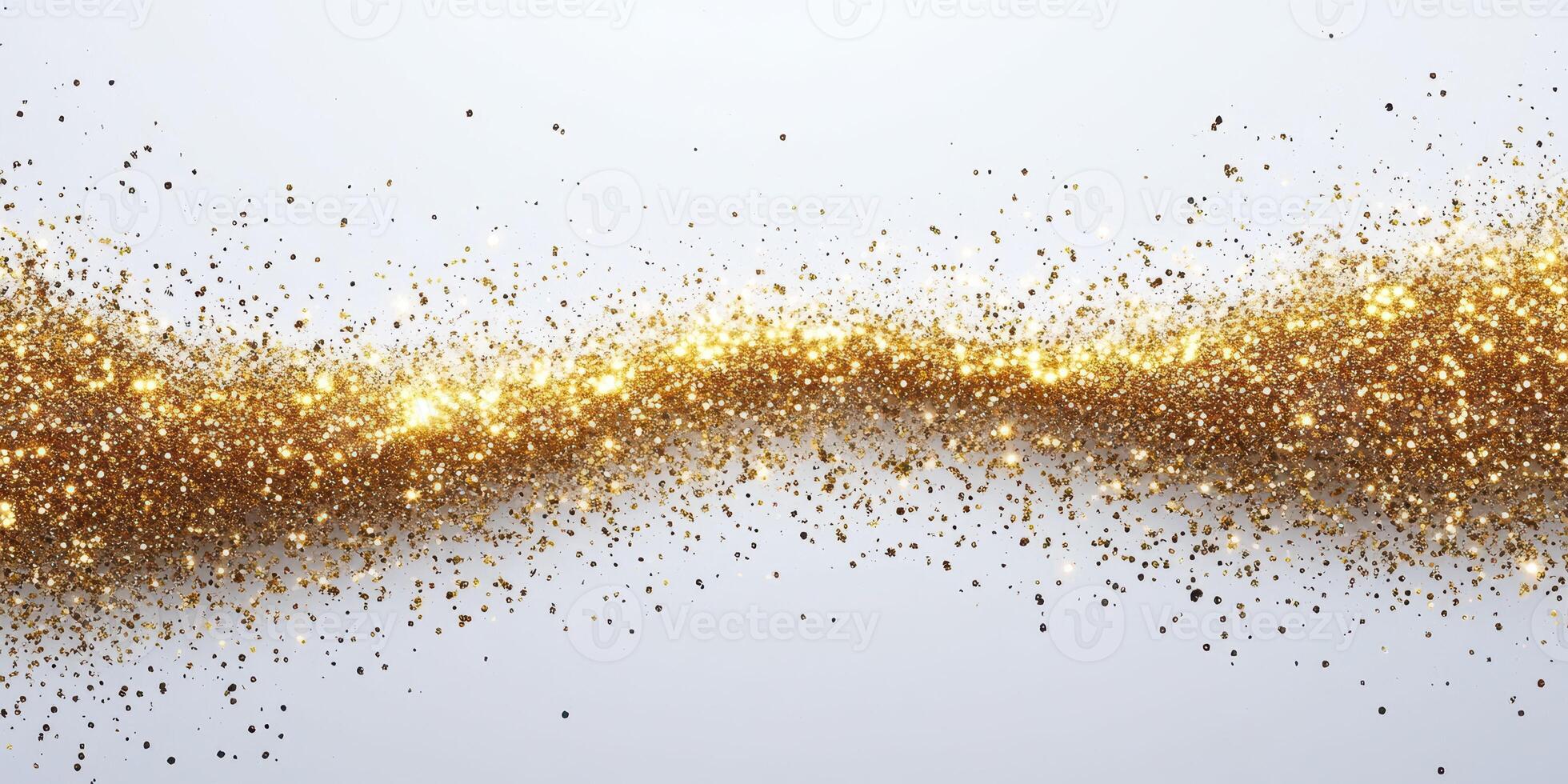 Sparkling golden glitter spreads across a light background creating a festive atmosphere photo