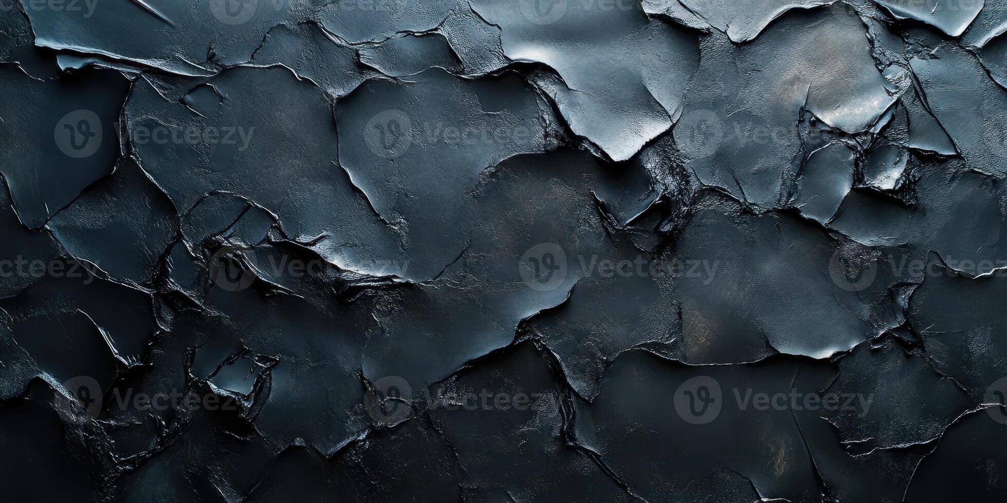 Textured black surface with peeling layers and intricate details presenting an abstract natural formation photo