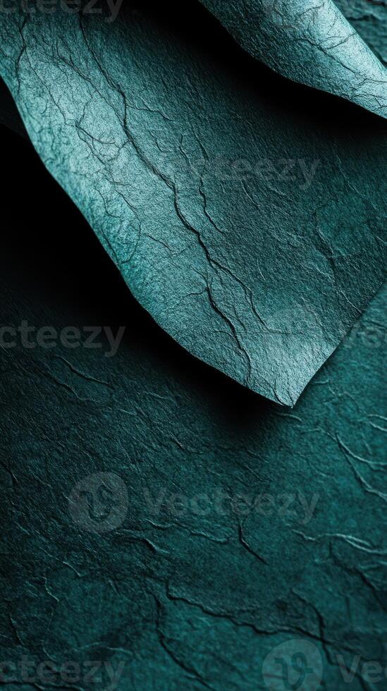 Unique teal textured paper showcasing intricate details and natural patterns under soft lighting photo