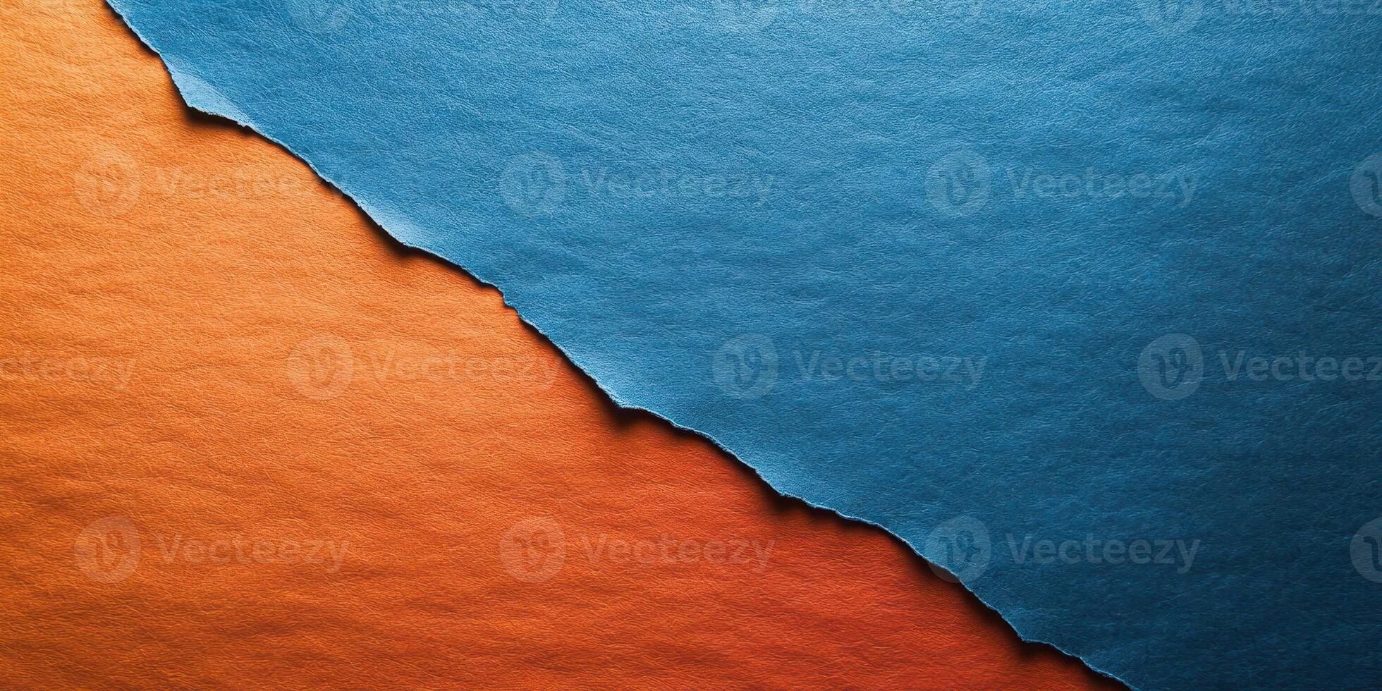 Colorful torn paper creating a striking contrast between blue and orange shades in an artistic display photo