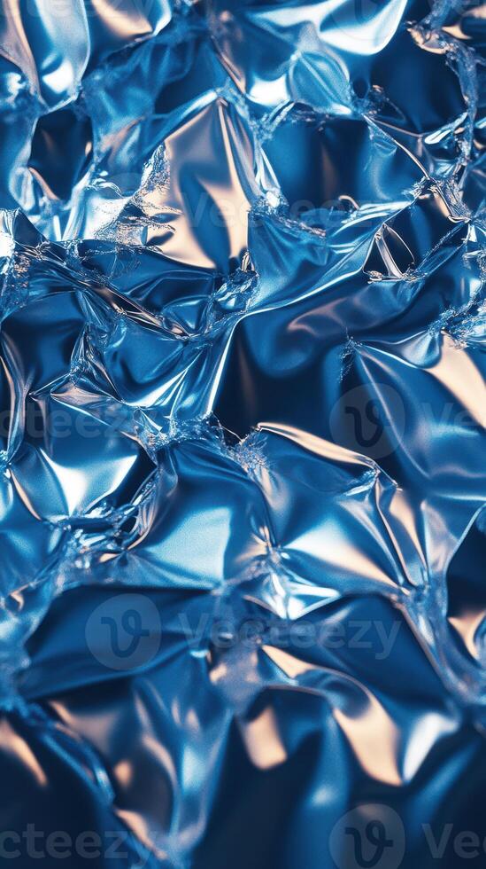 Shimmering blue foil texture with intricate patterns highlighted by light reflections photo