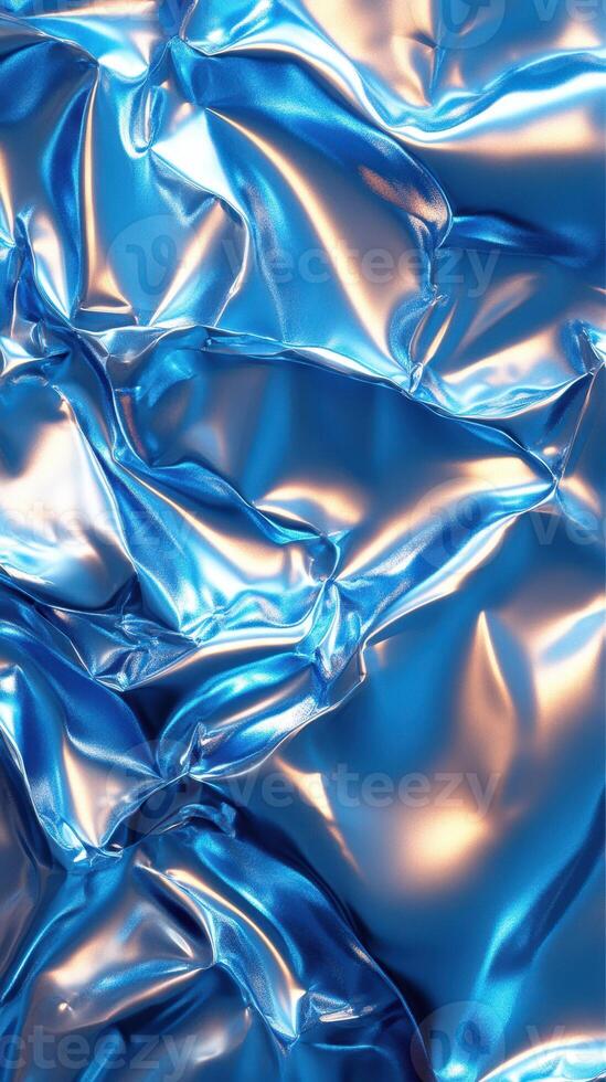 Textured blue fabric with shiny surface reflecting light in an abstract pattern photo