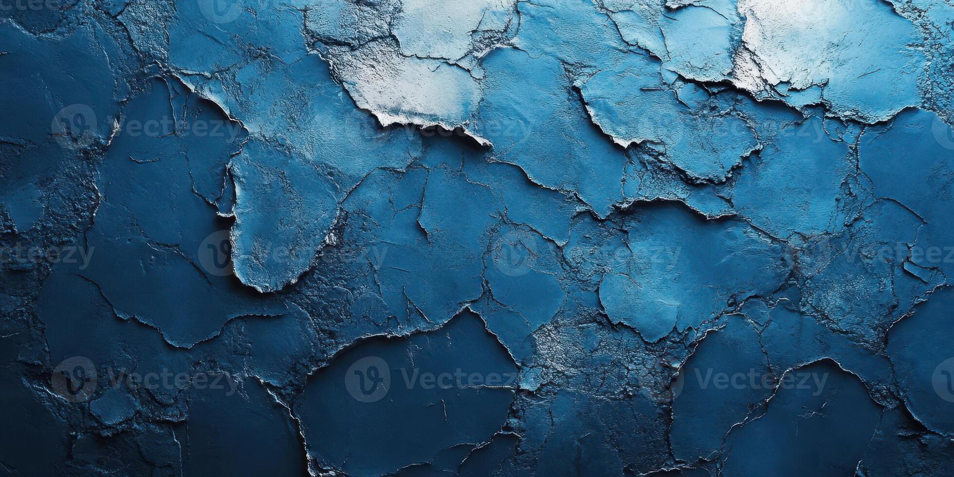 Cracked blue wall texture featuring vibrant shades and unique patterns illuminated by natural light in an artistic setting photo