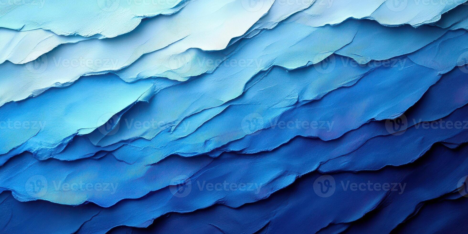 Abstract representation of ocean waves with varying shades of blue illustrating depth and movement photo