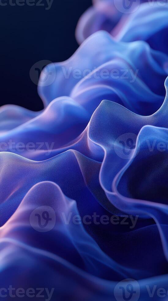 Elegant blue and purple fabric flowing gracefully in delicate waves under soft lighting photo