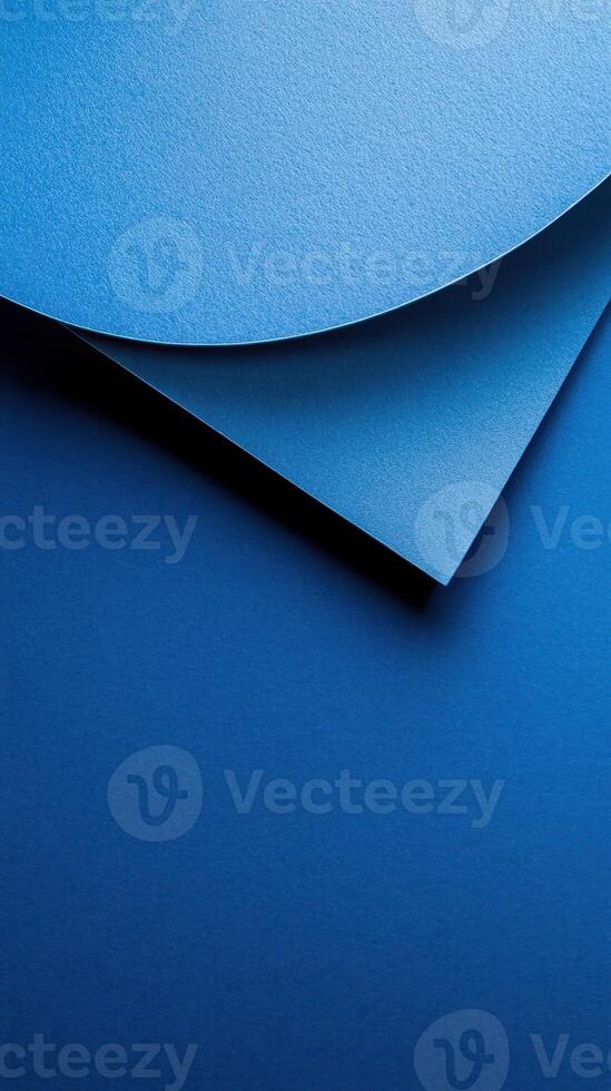 Vibrant blue paper layers create an artistic composition showcasing texture and color nuances photo