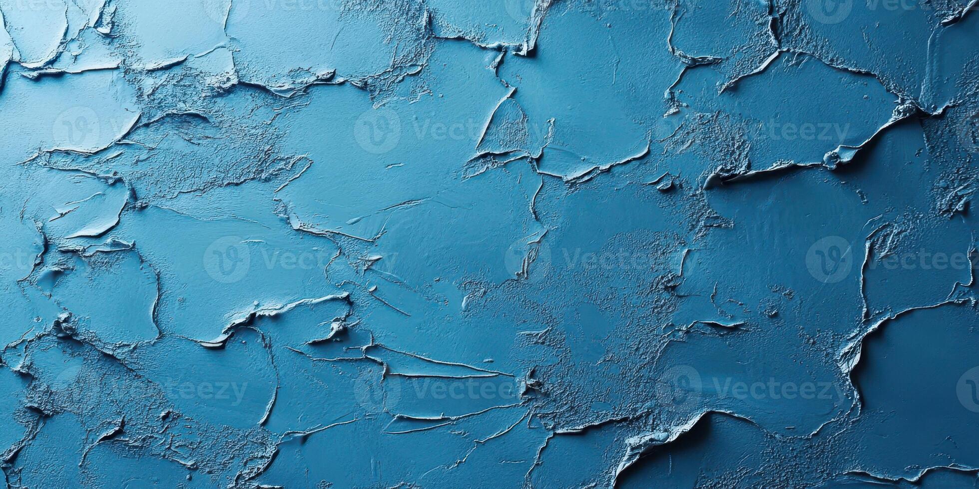 Textured blue wall with cracks and uneven surface showcasing a unique design and color depth in natural light photo