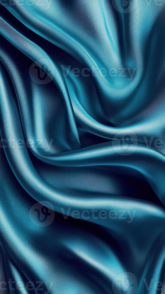 Beautiful blue silk fabric displaying luxurious texture and smooth drapes in elegant folds photo