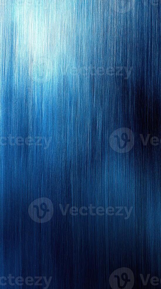 Textured blue background displaying gradients and sheen with subtle light reflections in an abstract setting photo