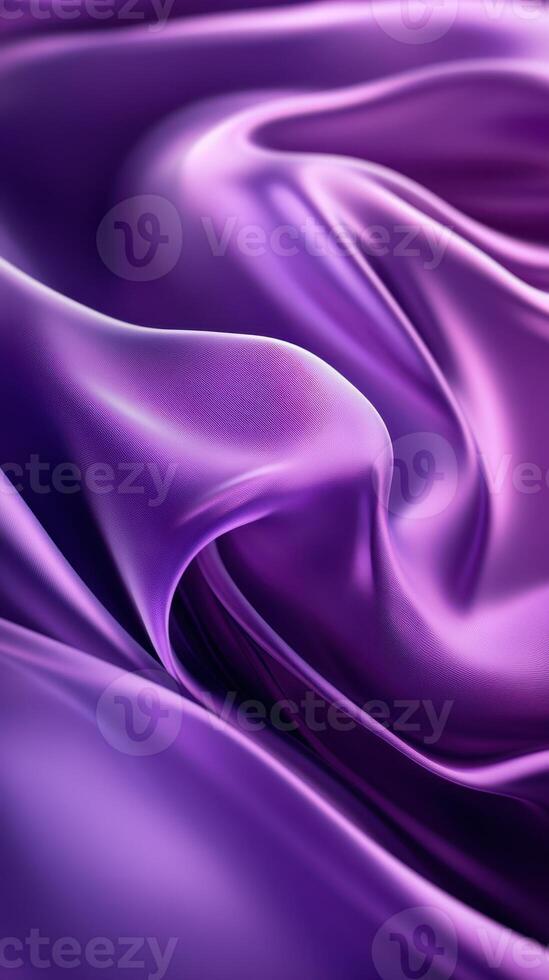 Soft flowing purple silk fabric creates an elegant texture in a richly colored surface, showcasing its smooth and lustrous quality photo