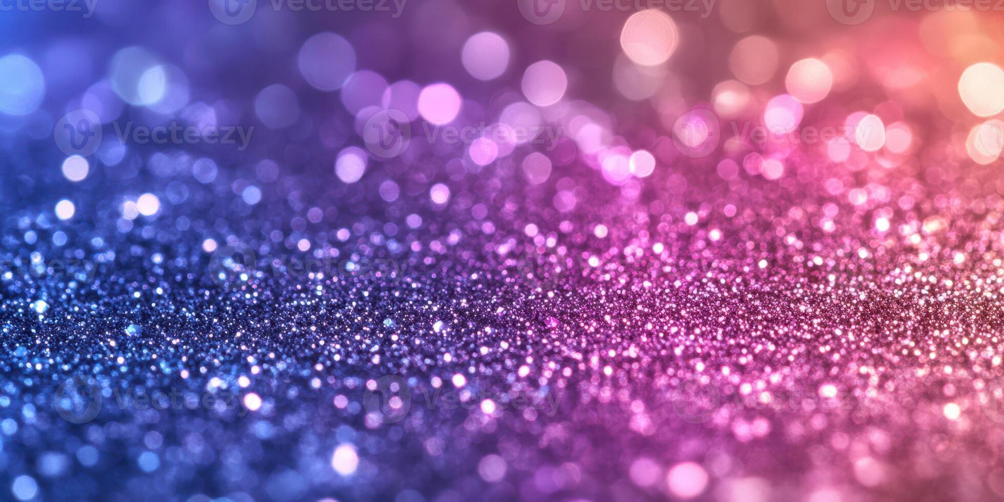 Shimmering micro glitters create a vivid backdrop with a blend of purple, blue, and pink hues in a soft bokeh effect photo
