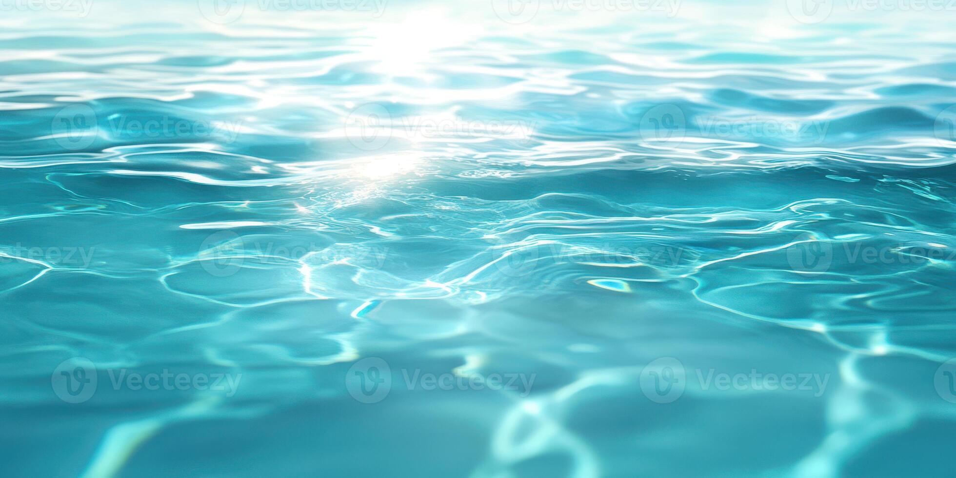 Clear turquoise water reflecting sunlight creates a serene aquatic view in a calm environment photo