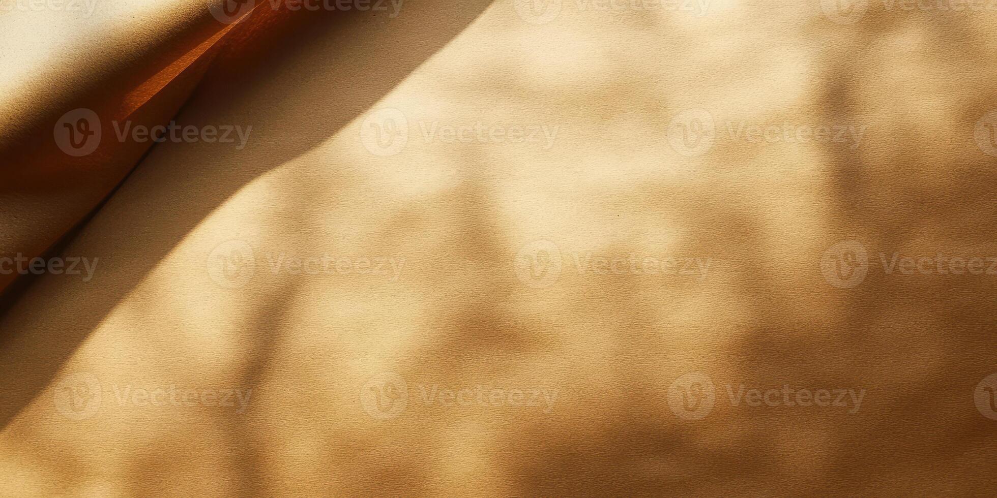 Soft texture of golden fabric illuminated by natural light casts gentle shadows in an elegant composition photo