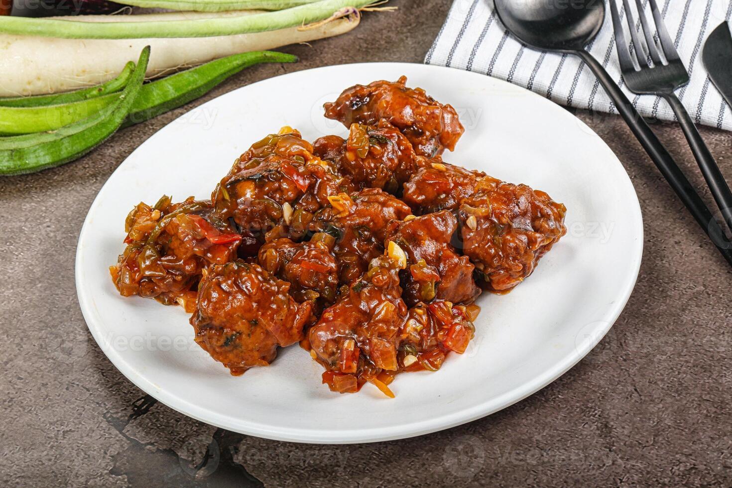 A plate of food with meat and vegetables on it photo