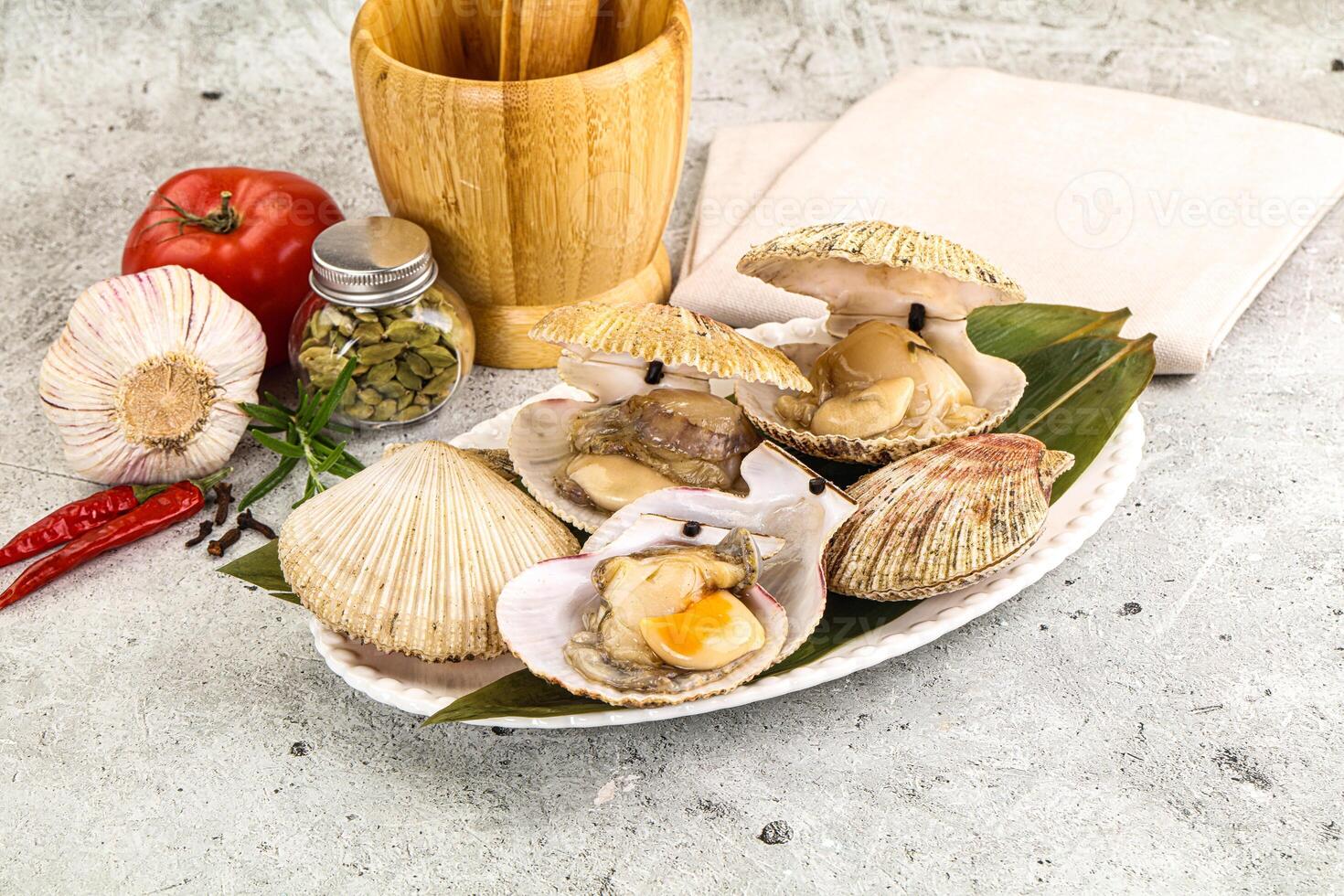 A plate with clams, peppers and other ingredients photo