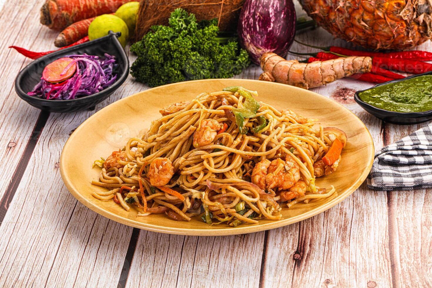 A plate of food on a table with a bunch of vegetables photo