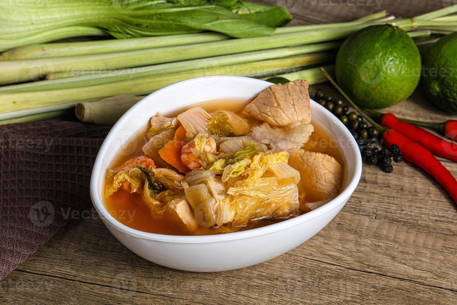 A bowl of soup with vegetables and other ingredients photo