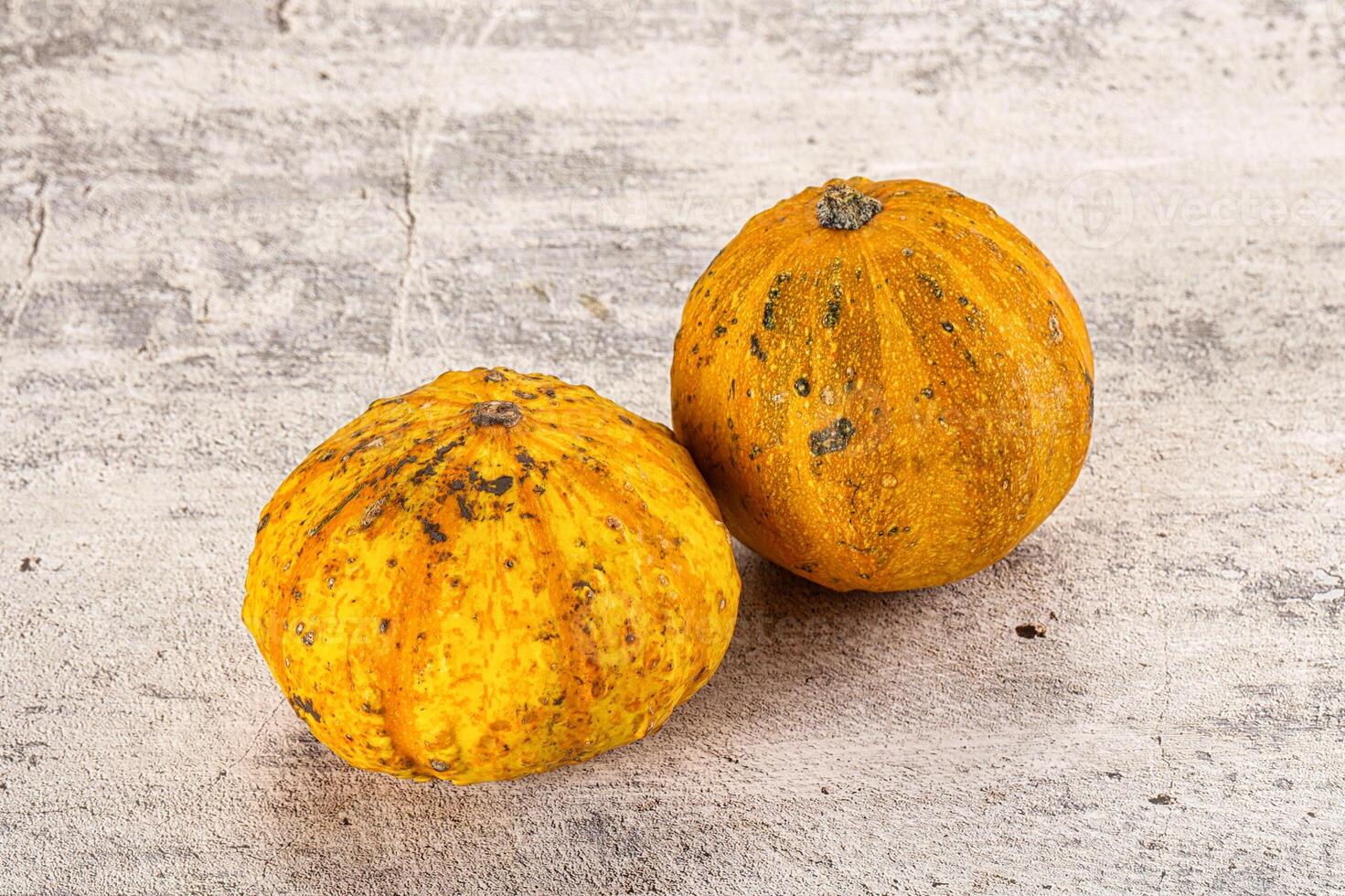 Two yellow squash on a table photo