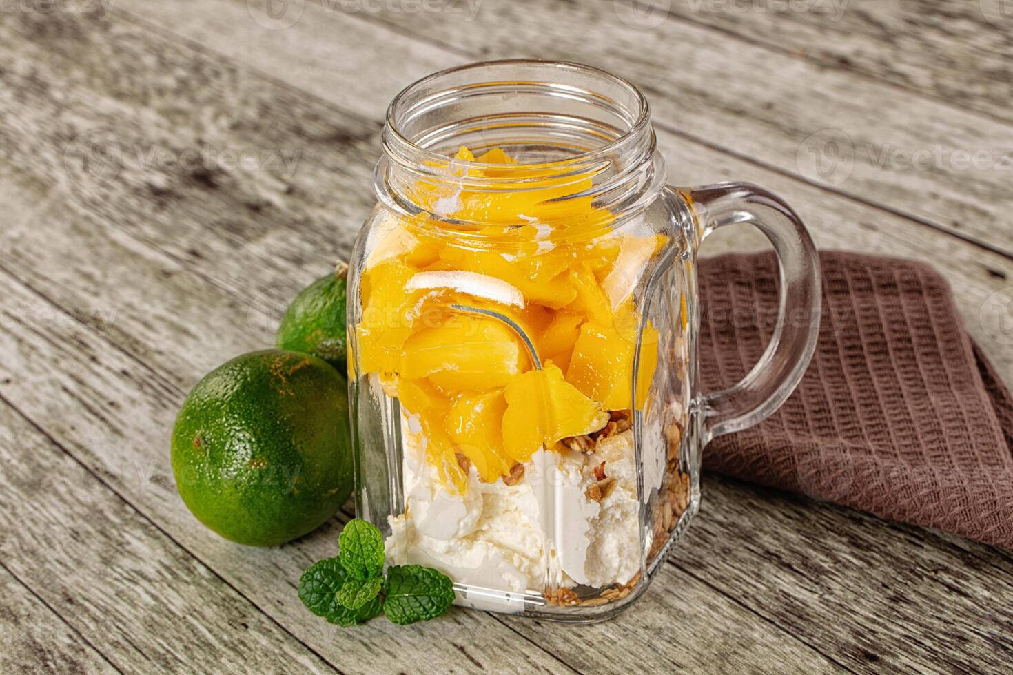 A glass jar with a spoon photo