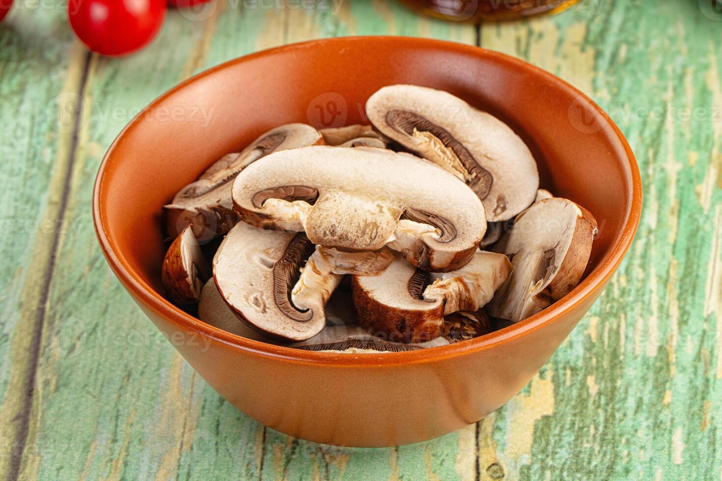 A bowl of mushrooms on a table photo