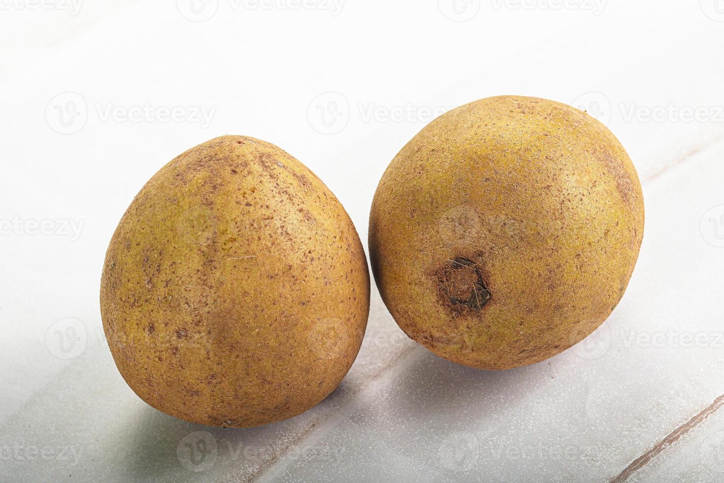 Two ripe bananas on a table photo