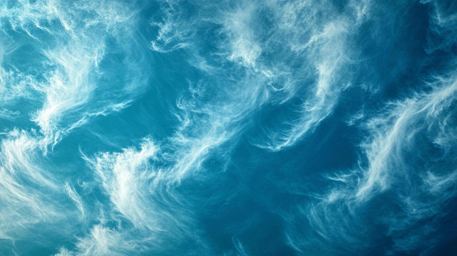 Sky panorama featuring streaky cirrus clouds in shades of white and blue, creating an airy and ethereal atmospheric vista. photo