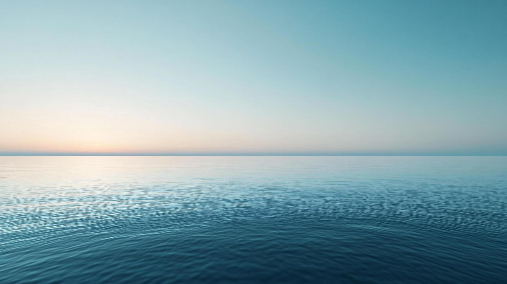 The ocean is calm and peaceful, with a beautiful blue sky in the background. The water is still and the sun is setting, creating a serene atmosphere photo