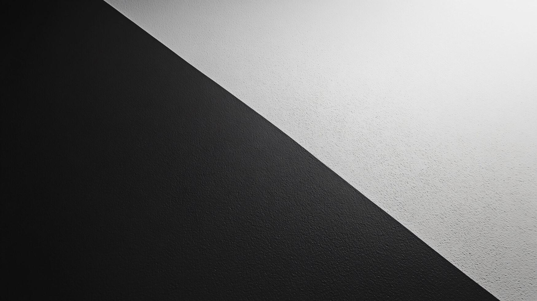 Textured background split by a diagonal line separating black and white colors photo