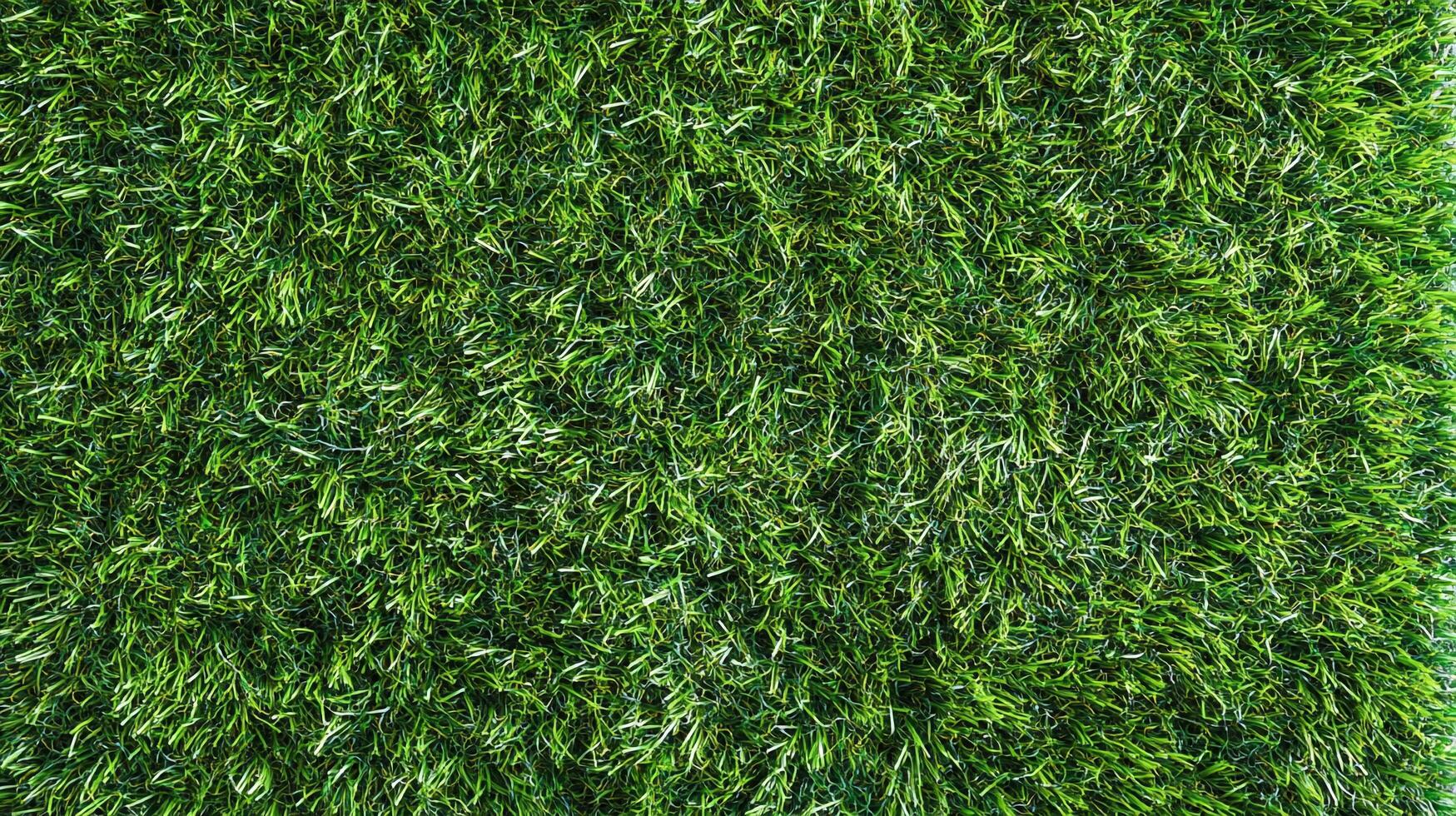 A vibrant, close-up shot showcasing a dense patch of healthy, green grass filling the frame, perfect for nature-themed backgrounds. photo