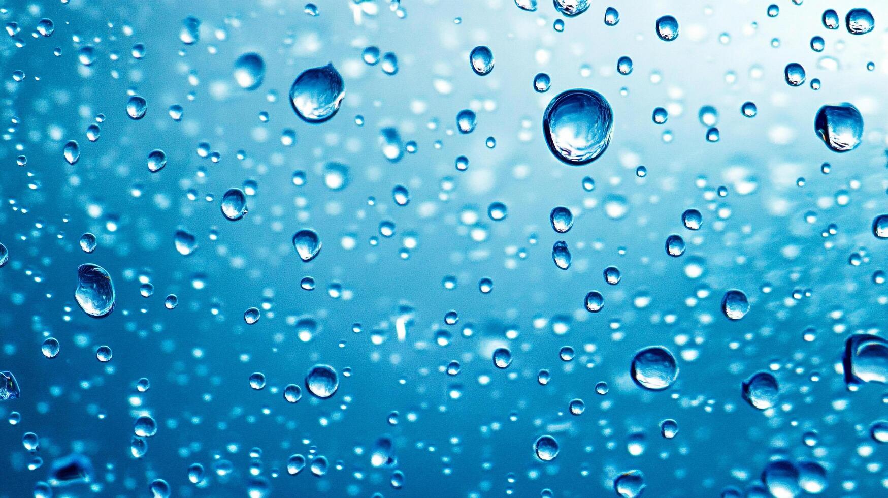 A captivating close-up of water droplets clinging to a surface, creating a mesmerizing pattern against a soft blue background. photo