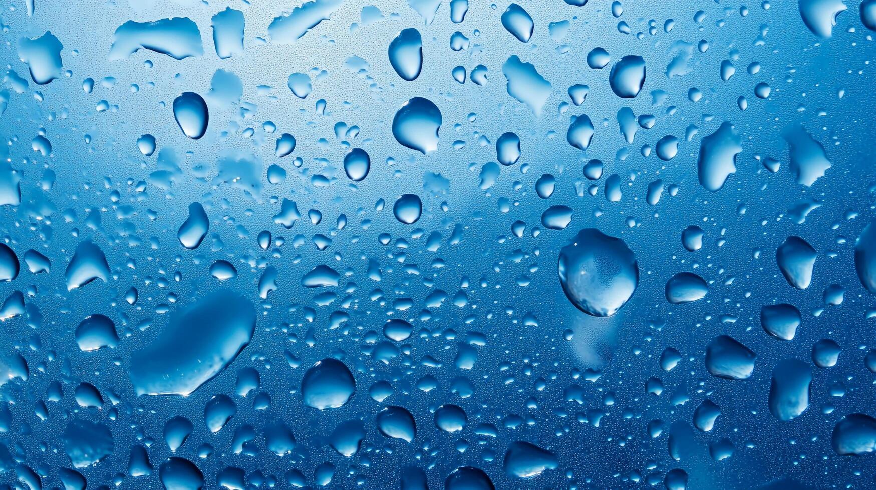 An artistic macro shot of water droplets cling to a glossy, blue surface, highlighting the beauty of nature's patterns and reflections. photo