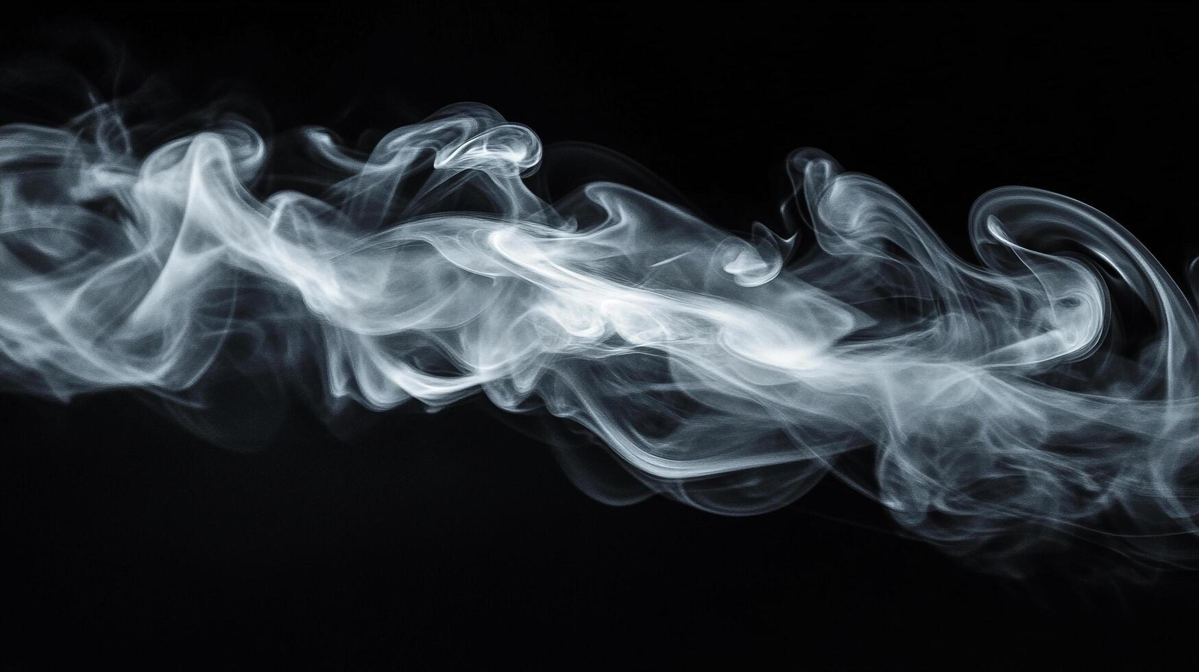 Wisp of smoke gracefully drifts and swirls across a stark black backdrop, creating an elegant and ethereal visual effect. photo