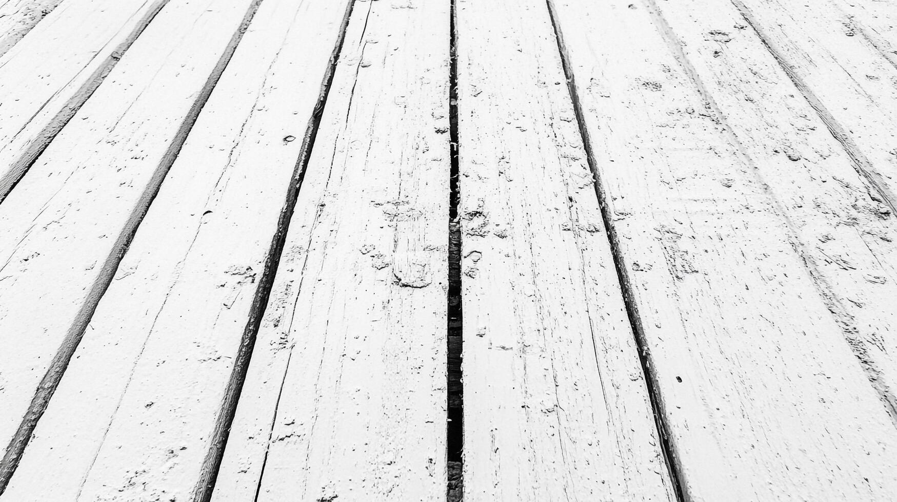 Monochrome textured wooden planks, painted white, showing wear and tear. Lines in perspective lead into distance, creating depth. photo