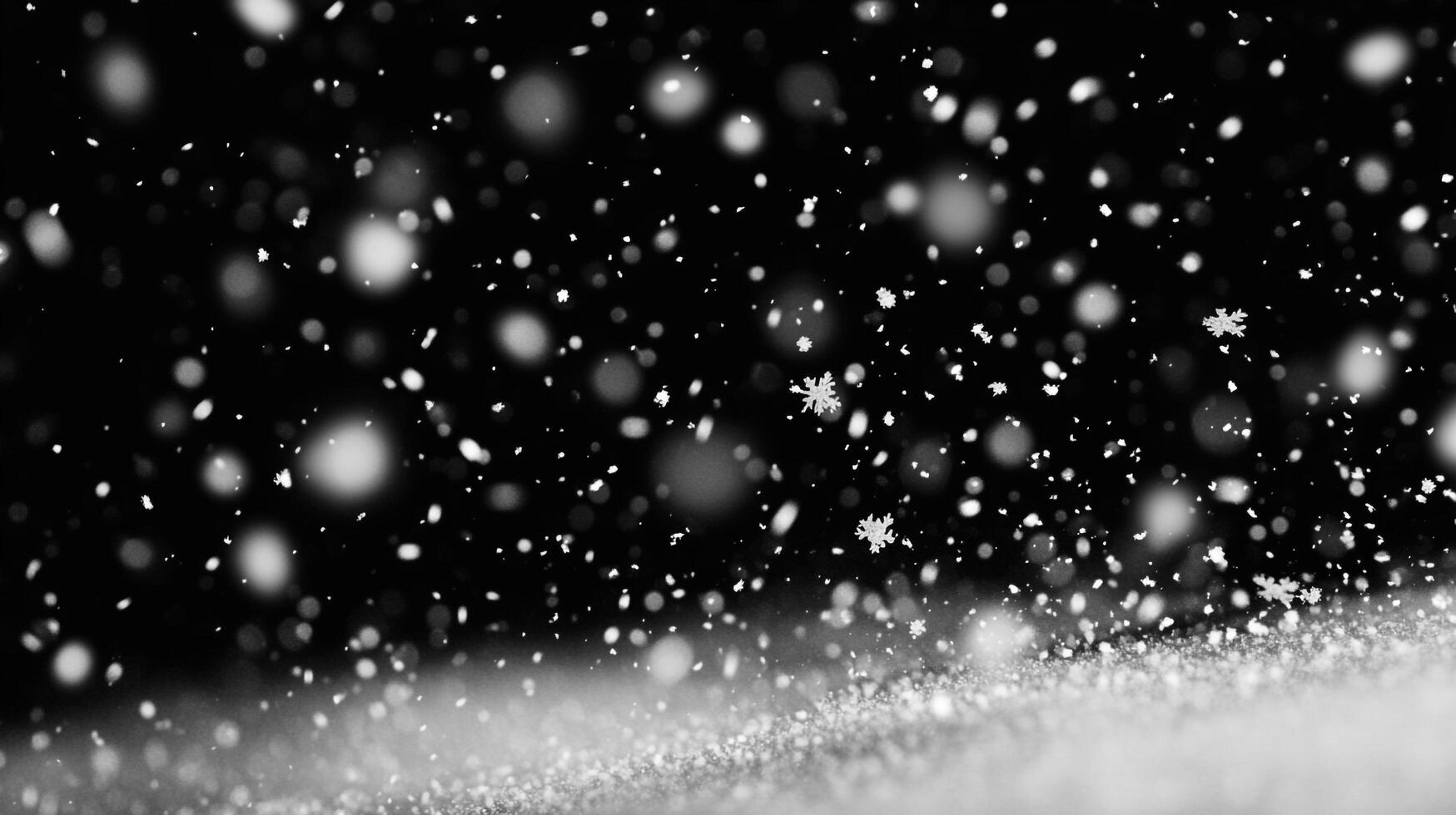 A flurry of snowflakes descends on a dark winter night, illuminated against the black background, creating a magical winter scene. photo