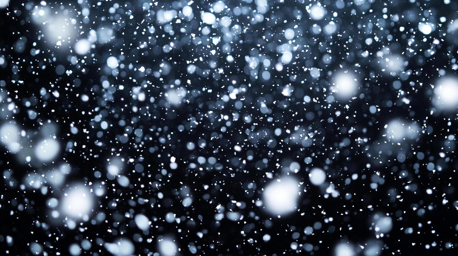 Snowfall creates a magical atmosphere as fluffy white flakes descend against the dark sky, creating a winter wonderland scene. photo