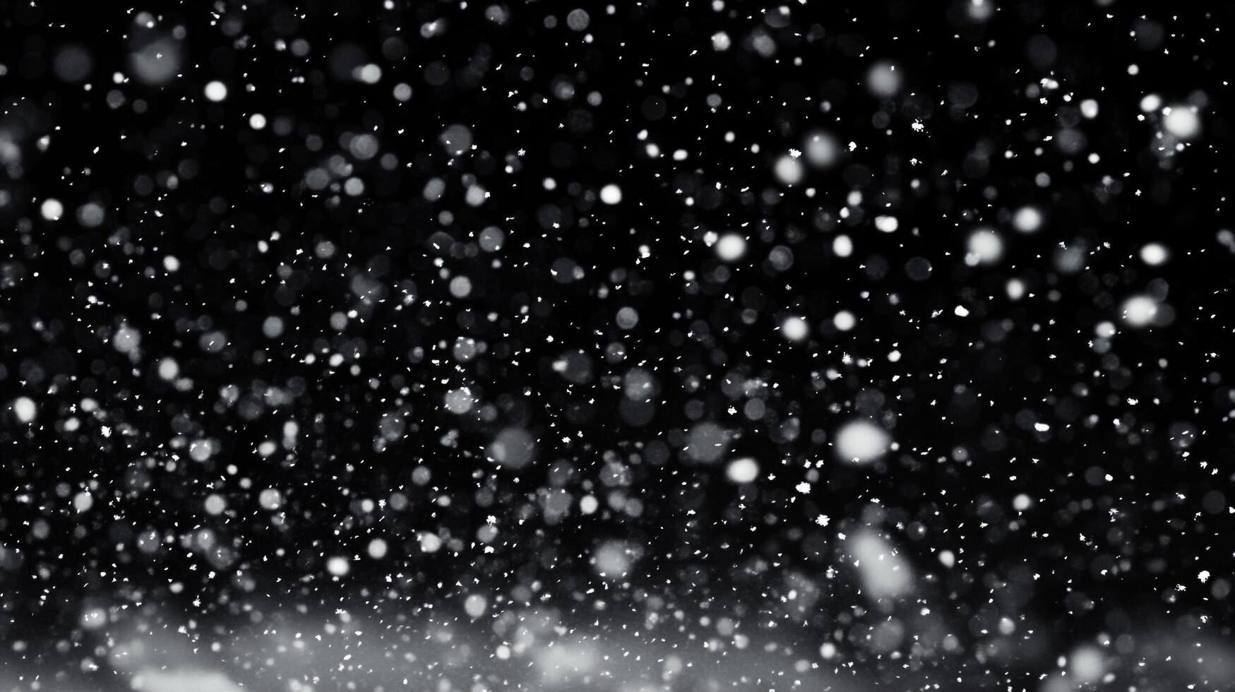 A flurry of white, snow falling against a dark background evokes winter's chill and the serene beauty of nature's dance. Snowflakes glimmer. photo
