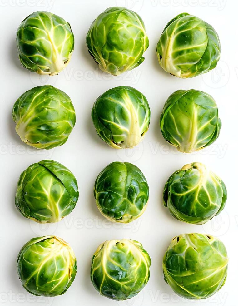 Freshly harvested Brussels sprouts arranged in a neat pattern on a clean white surface photo