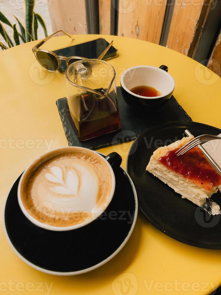 Coffee and Dessert Delight in a Cozy Caf Setting. Enjoy a serene moment with coffee and cheesecake in a vibrant caf atmosphere. vertical, film look photo