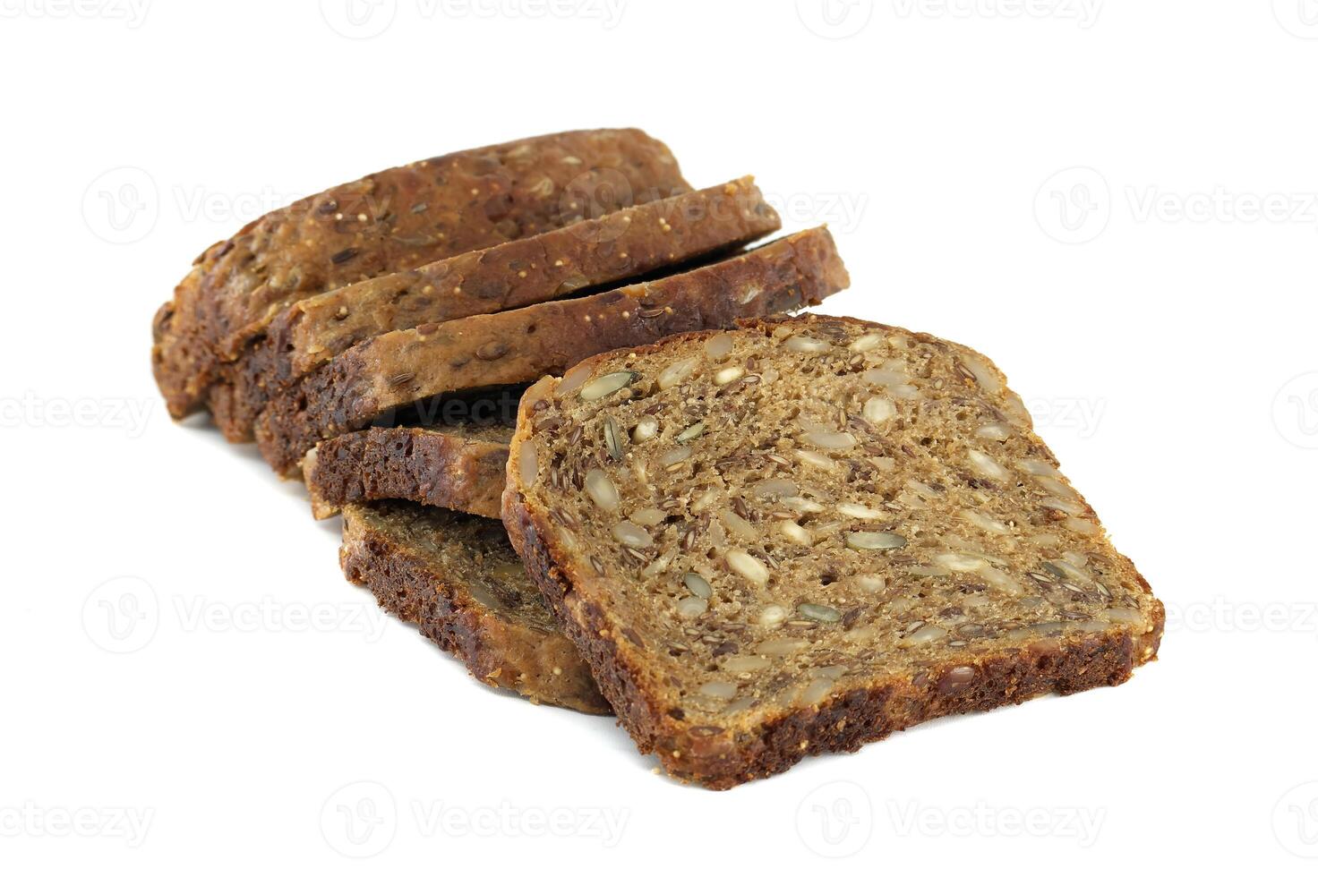 Several slices of dark multigrain bread are stacked, showing off the healthy mix of seeds. photo