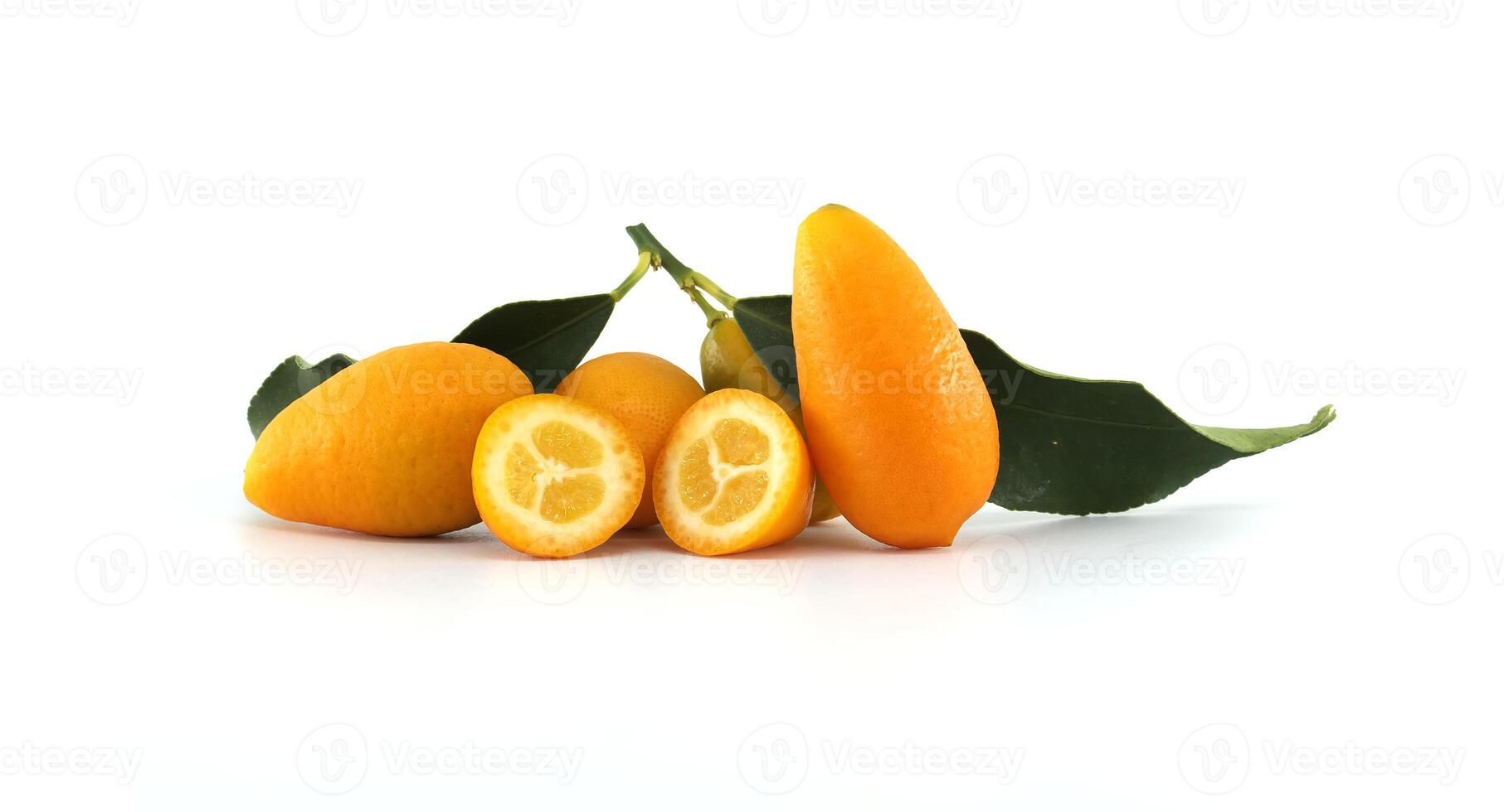 Fresh kumquats with leaves showing the inside on white background photo