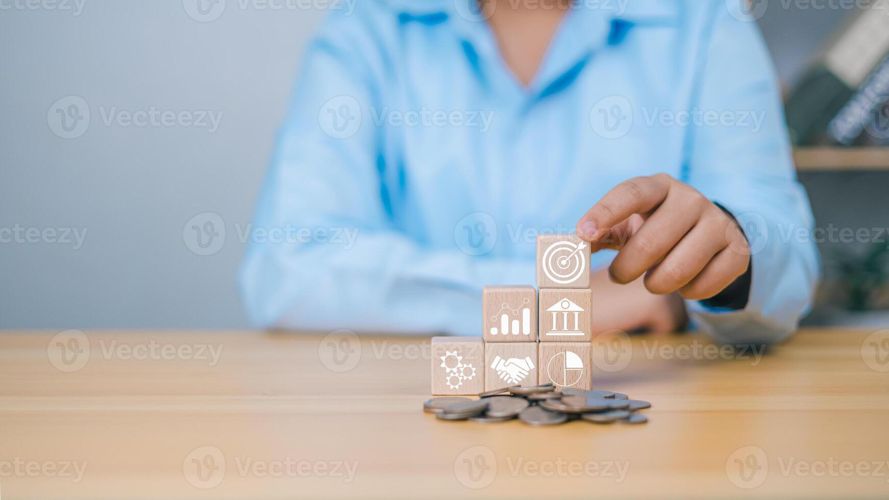 Goal and target, Business goal management, Investment on project to wealth, Success and business strategy target concept, Company strategy development, Human choose wood cube with business action plan photo
