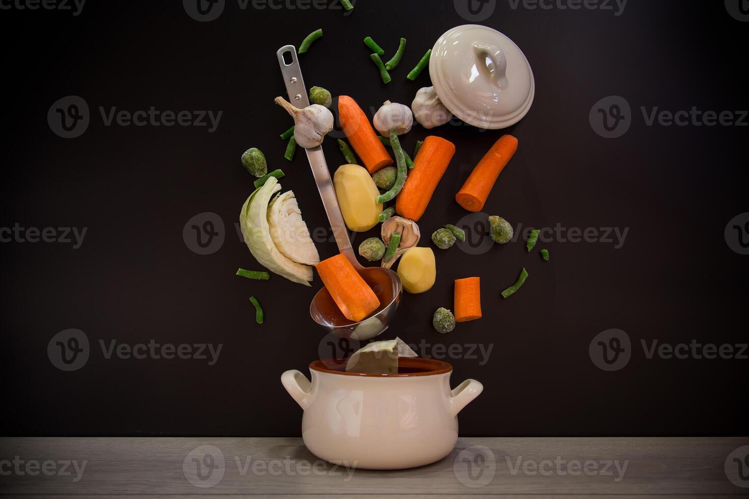 recipes with vegetables. Vegetables in motion before cooking in soup photo
