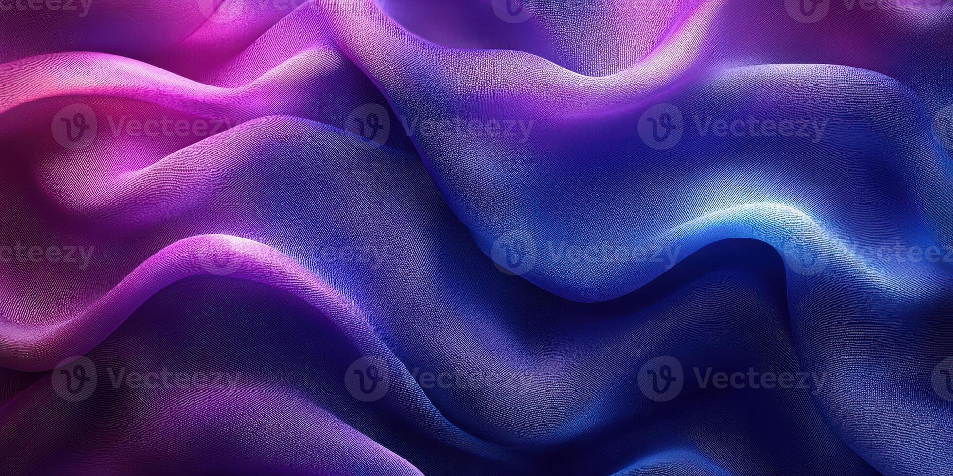 Beautiful flowing fabric patterns in shades of pink, purple, and blue create an artistic backdrop photo