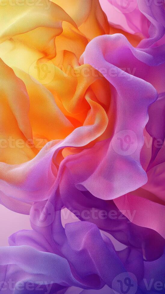 Colorful layers of translucent fabric flow together creating a vibrant abstract composition photo